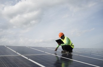 Technician engineer checks the maintenance of the solar cell panels.